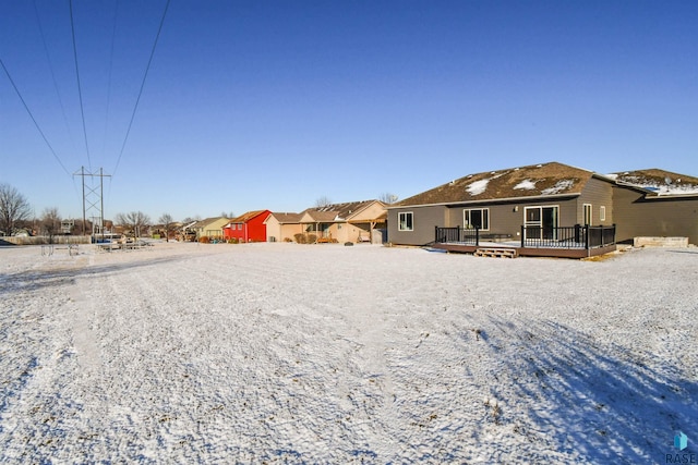 rear view of property featuring a deck