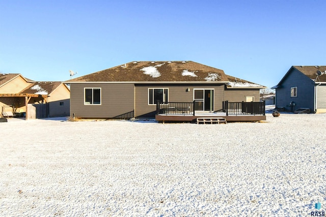 rear view of house with a wooden deck