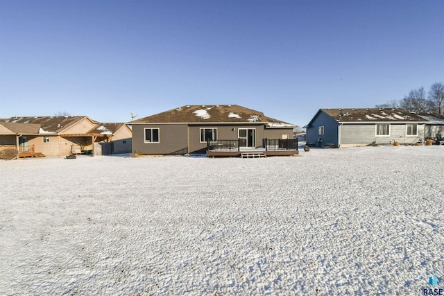 rear view of property with a wooden deck