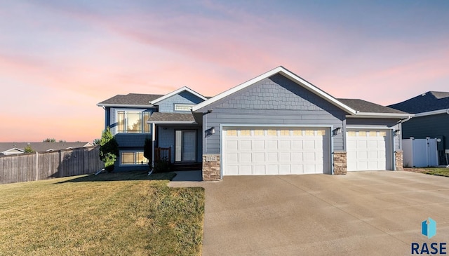 view of front of house with a lawn and a garage