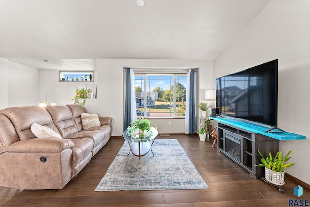 living room with lofted ceiling and dark hardwood / wood-style floors