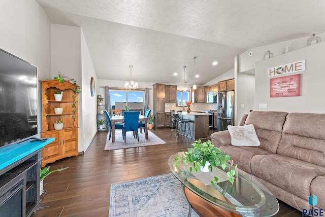 living room featuring lofted ceiling, a chandelier, and dark hardwood / wood-style flooring