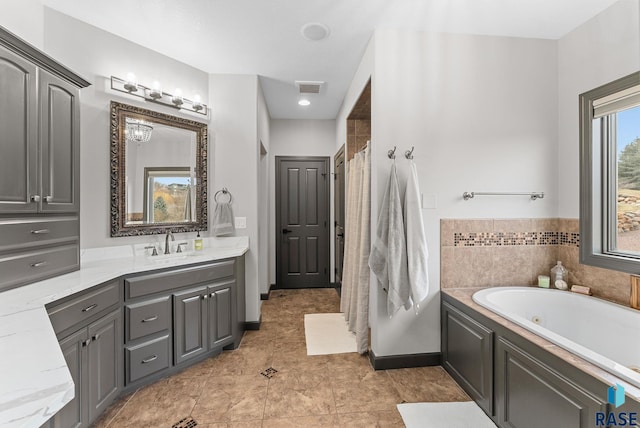 bathroom featuring vanity, tile patterned floors, and plus walk in shower