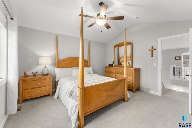 bedroom with ceiling fan, light carpet, and lofted ceiling