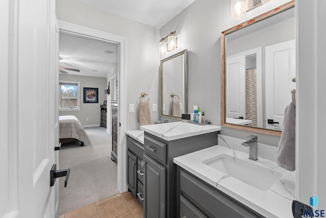 bathroom with ceiling fan, tile patterned floors, and vanity