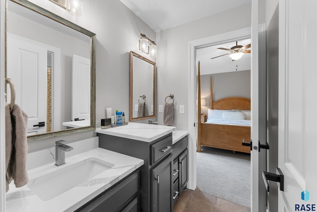 bathroom with vanity, tile patterned flooring, and ceiling fan