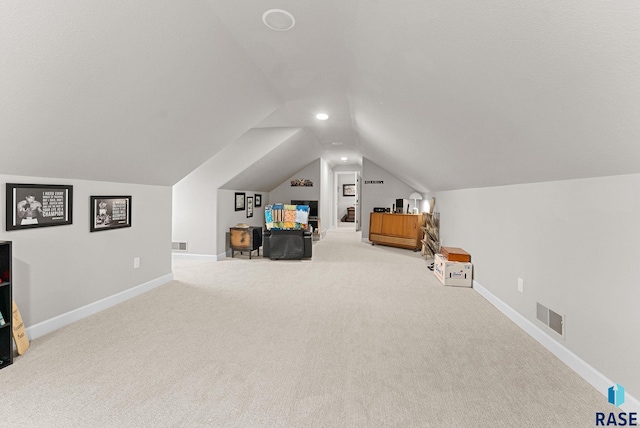 bedroom featuring lofted ceiling and carpet flooring