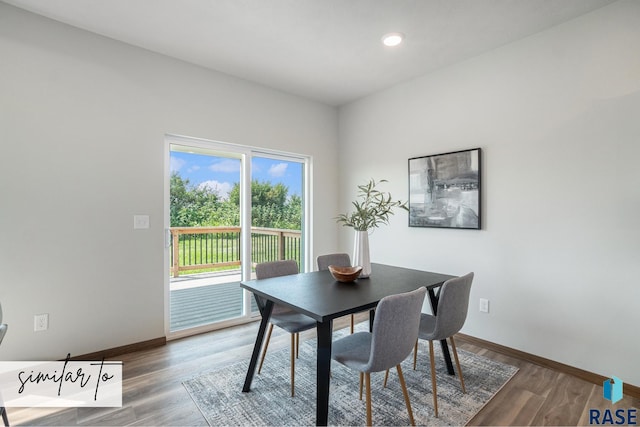 dining area with hardwood / wood-style flooring