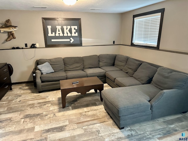 living room featuring a textured ceiling