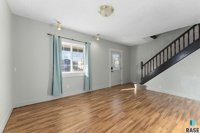 entryway with hardwood / wood-style flooring