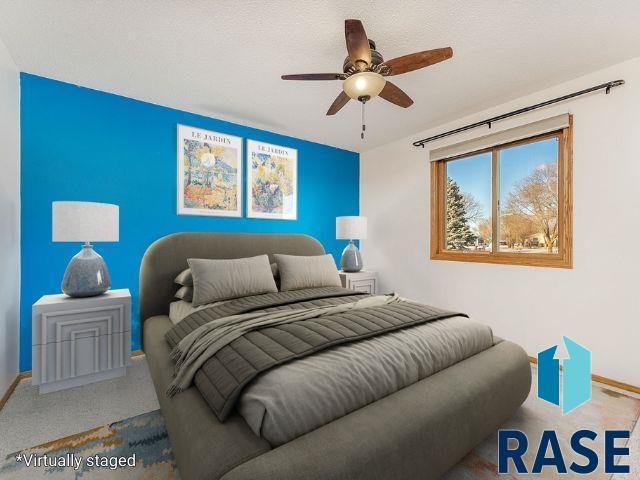 bedroom featuring carpet flooring, a ceiling fan, and baseboards