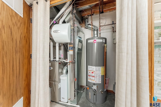 utility room featuring water heater