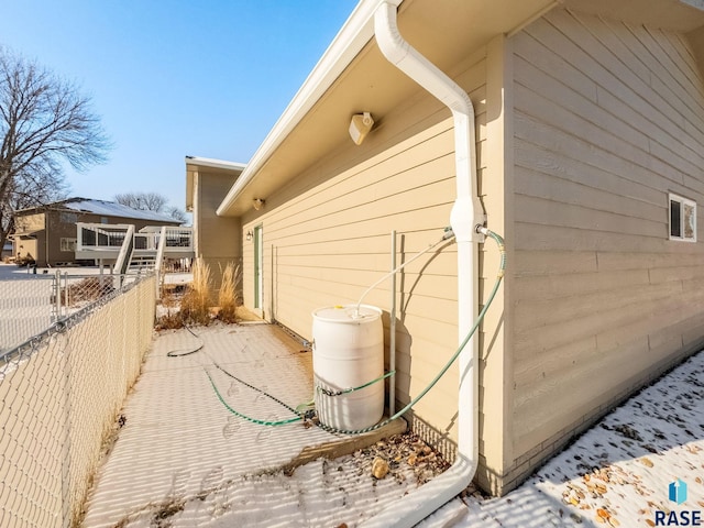 view of side of property featuring fence