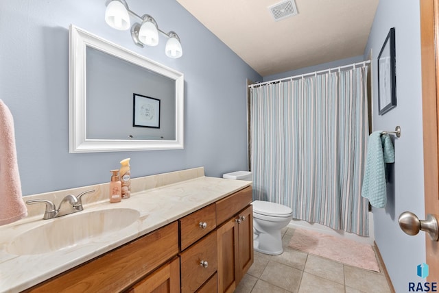 bathroom with vanity, a shower with curtain, tile patterned floors, and toilet