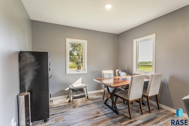 dining area with wood-type flooring