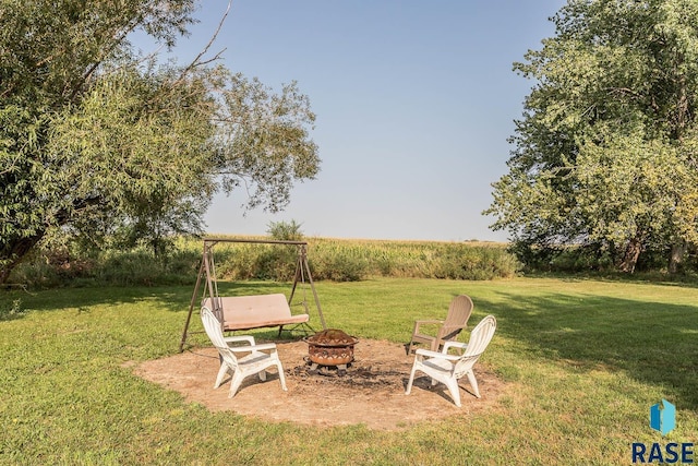 view of yard with a fire pit