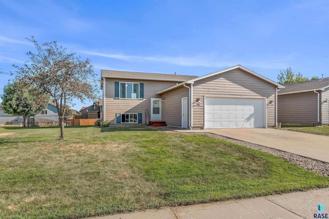 view of front of property with a garage and a front yard