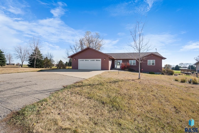 single story home with a front lawn and a garage