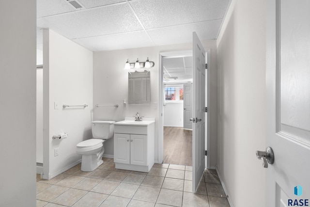 bathroom featuring vanity, tile patterned floors, and toilet