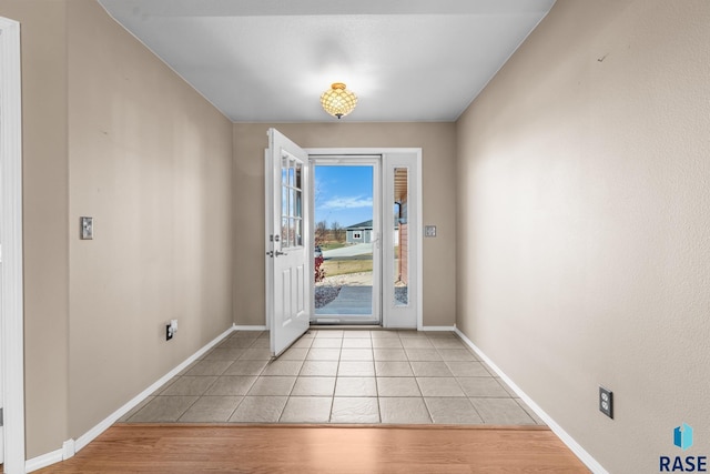 entryway with light tile patterned floors