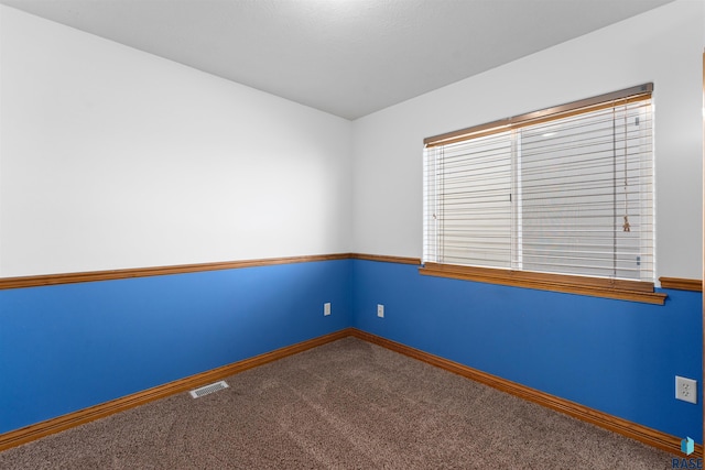 unfurnished room featuring carpet floors