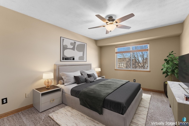 bedroom with ceiling fan and light colored carpet