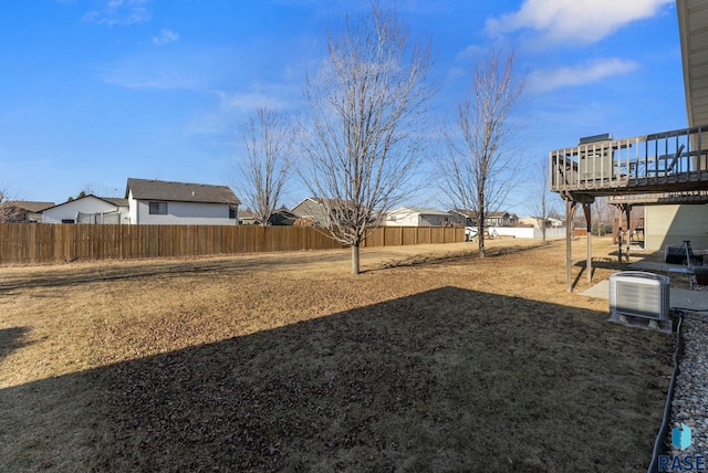 view of yard featuring central AC and a wooden deck