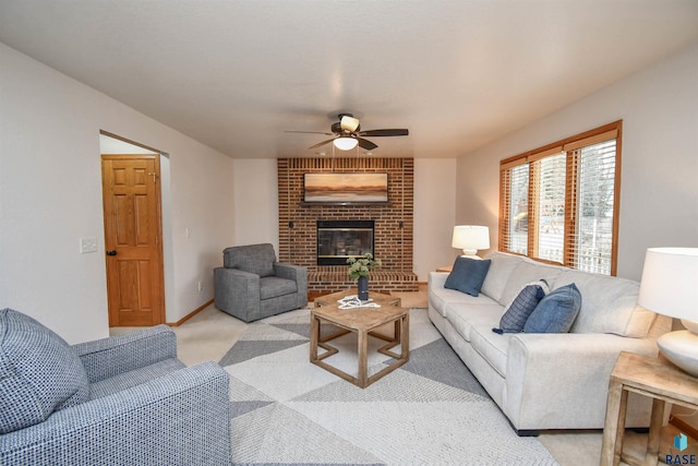 living room with light carpet, a fireplace, and ceiling fan