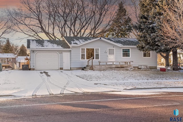 ranch-style house featuring a garage