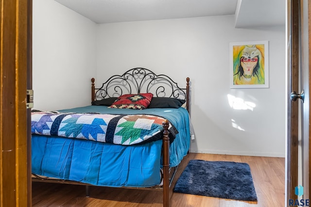 bedroom featuring hardwood / wood-style flooring