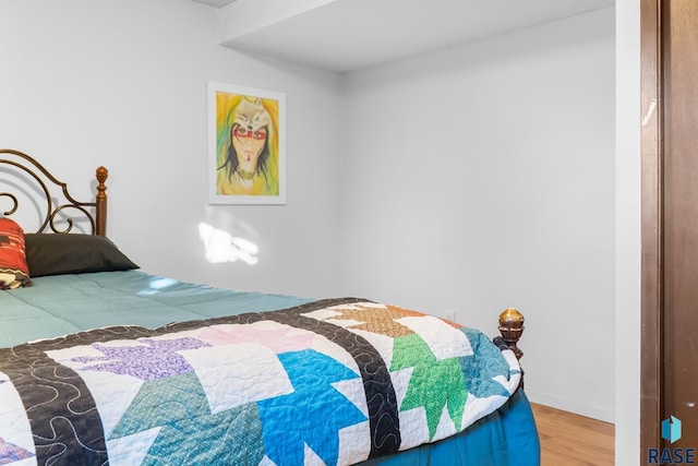 bedroom featuring hardwood / wood-style floors