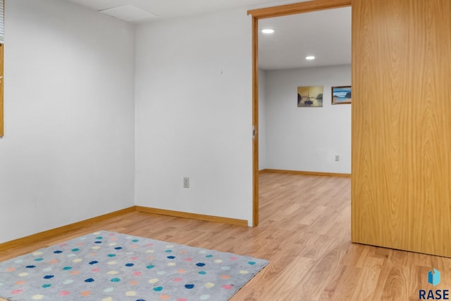 empty room with hardwood / wood-style flooring