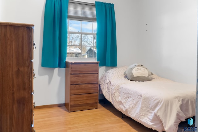 bedroom with light hardwood / wood-style floors