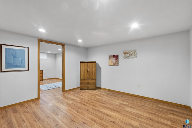 spare room with light wood-type flooring