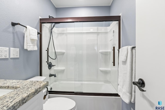 full bathroom featuring shower / bath combination with glass door, toilet, and vanity