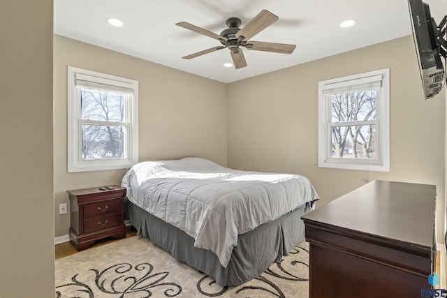 bedroom featuring ceiling fan and light hardwood / wood-style flooring