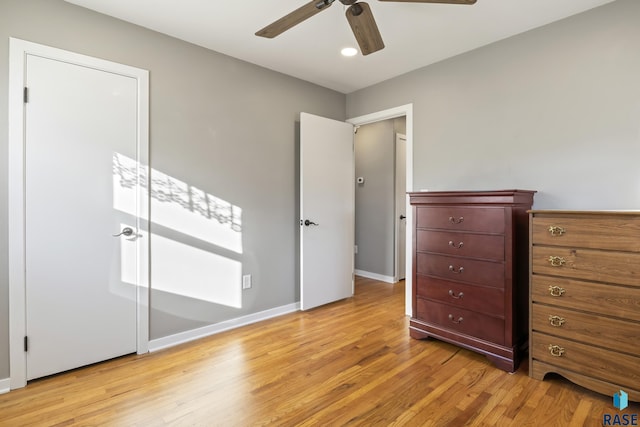 unfurnished bedroom featuring ceiling fan and light wood-type flooring