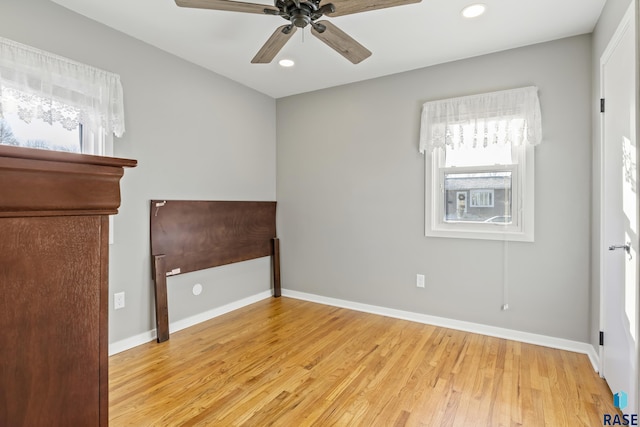 empty room featuring ceiling fan and light hardwood / wood-style flooring