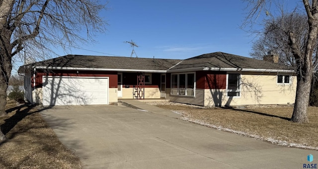 ranch-style house featuring a porch and a garage