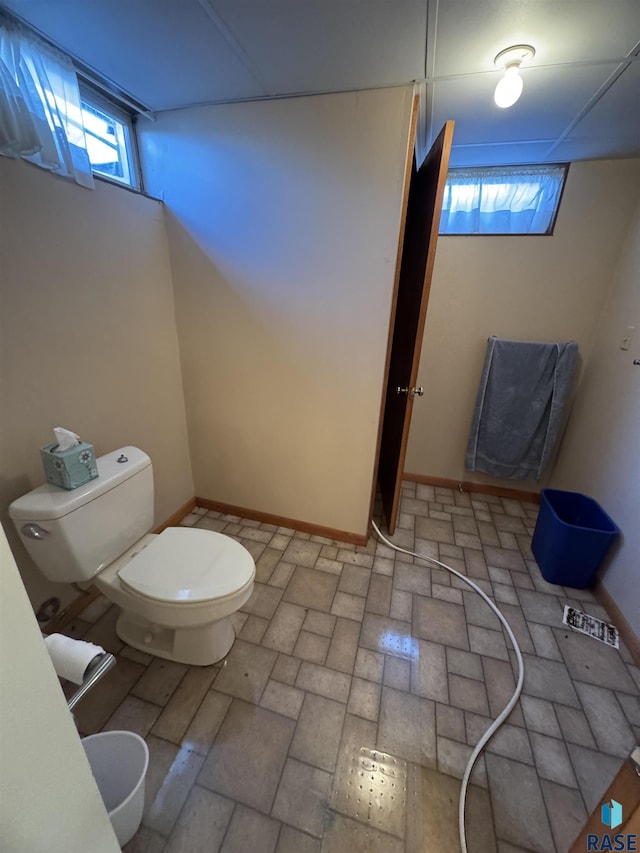 bathroom featuring toilet and a healthy amount of sunlight