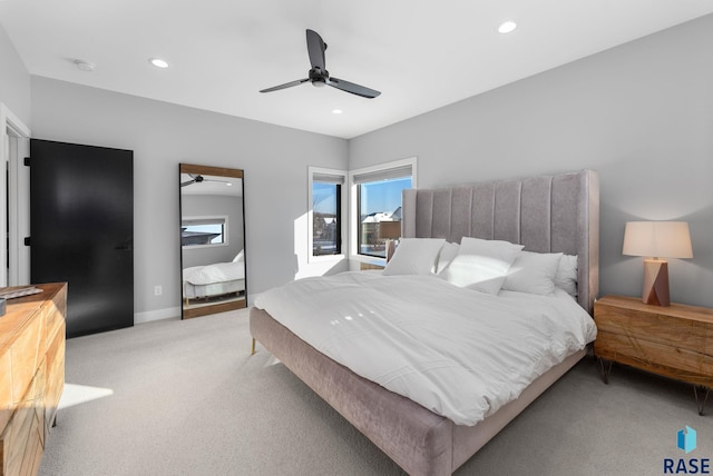 bedroom with light colored carpet and ceiling fan