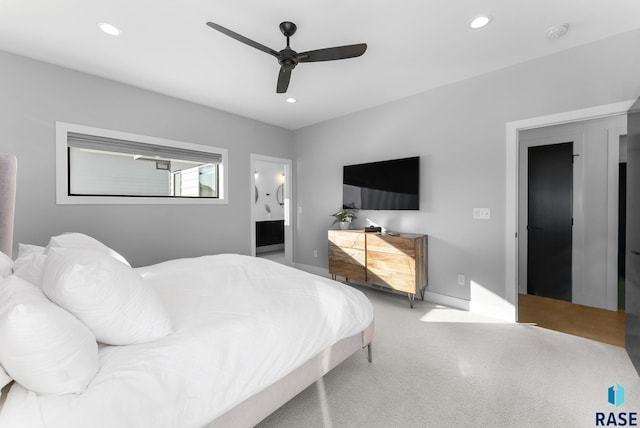 bedroom featuring ensuite bathroom and ceiling fan