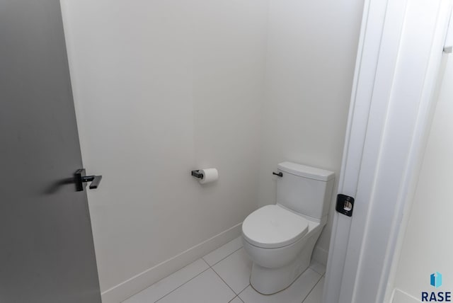 bathroom with tile patterned floors and toilet