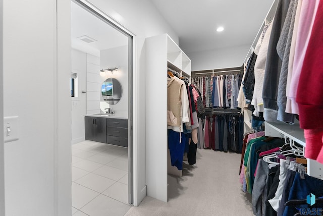 spacious closet featuring sink