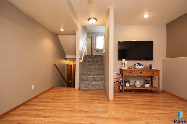 stairs with hardwood / wood-style flooring