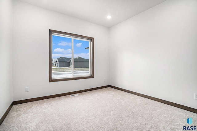 unfurnished room with carpet floors