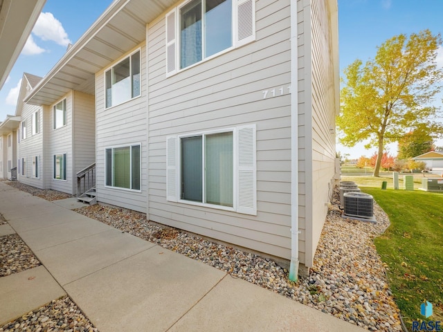 view of side of property featuring central AC unit