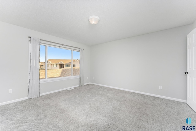 empty room with carpet flooring