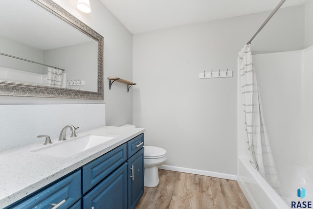 full bathroom with vanity, toilet, shower / bath combo with shower curtain, and wood-type flooring