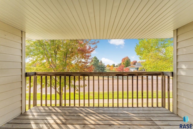 wooden terrace with a yard